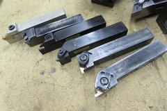 Quick Change Aloris-Type Tool Post with (4) Slide on Holders and Assorted Turning Tools