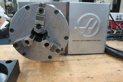 Haas HRT-A6 Brushless Drive Rotary Table with Cables and Interface, 8.25" 3-Jaw Chuck, Sigma-1 Servo Motor, A1-6 Spindle Nose Mount, 16C Air Collet Closer.