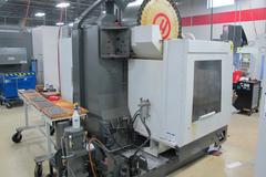 Haas VF-4SS 5-Axis CNC Vertical Machining Center with Haas TR160Y Compact Trunnion Table, 1000PSI Through Spindle Coolant, Renishaw Probing System, and High Speed Machining.
