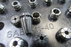 (40) Assorted ER11 Collets with Rack