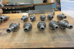 (10) Nikken Cat 40 Taper SK-10 Collet Tool Holders with Rack and Assorted SK-10 FLex Collets