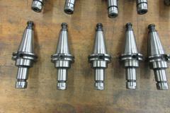 (10) Nikken Cat 40 Taper SK-10 Collet Tool Holders with Rack and Assorted SK-10 FLex Collets