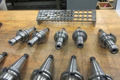 (10) Nikken Cat 40 Taper SK-10 Collet Tool Holders with Rack and Assorted SK-10 FLex Collets