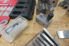 Assorted Toolmaker's Items: Radius Gages, Toe Clamps, V-Blocks, Angle Blocks, Edge Finders and More