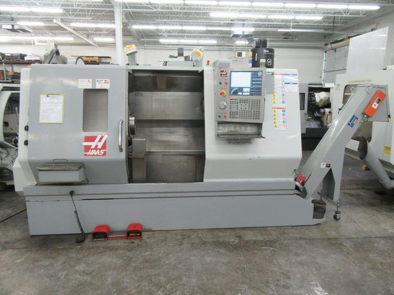 Haas SL-30 2-Axis CNC Turning Center with Programmable Tailstock, Tool Presetter, Chip Conveyor, and more.