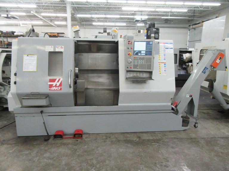 Haas SL-30 2-Axis CNC Turning Center with Programmable Tailstock, Tool Presetter, Chip Conveyor, and more.