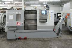 Haas SL-30 2-Axis CNC Turning Center with Programmable Tailstock, Tool Presetter, Chip Conveyor, and more.