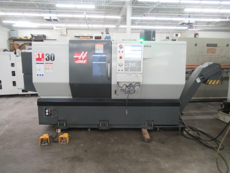 Haas ST-30 2-Axis CNC Turning Center with 12" 3-Jaw Chuck, Tool Presetter, Programmable Tailstock, and Chip Conveyor.
