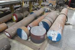 Raw Material Contents of Bar Stock Area Including (4) Racks, Material On Floor up to 17" x 98" Round Steel Bar, Aluminum, and More.  THOUSANDS OF POUNDS OF STEEL!!