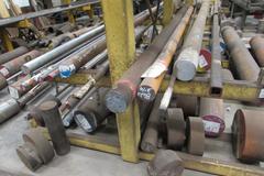 Raw Material Contents of Bar Stock Area Including (4) Racks, Material On Floor up to 17" x 98" Round Steel Bar, Aluminum, and More.  THOUSANDS OF POUNDS OF STEEL!!
