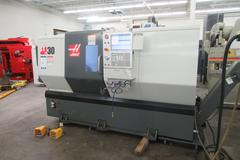 Haas ST-30 2-Axis CNC Turning Center with 12" 3-Jaw Chuck, Tool Presetter, Programmable Tailstock, and Chip Conveyor.