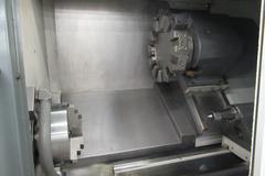 Haas ST-30 2-Axis CNC Turning Center with 12" 3-Jaw Chuck, Tool Presetter, Programmable Tailstock, and Chip Conveyor.