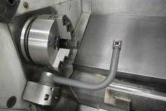 Haas ST-30 2-Axis CNC Turning Center with 12" 3-Jaw Chuck, Tool Presetter, Programmable Tailstock, and Chip Conveyor.