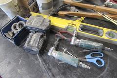 Assortment of Tools: Pneumatic Grinders, Cordless Drill, Level, Abrasives, and More