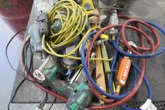 Assortment of Tools: Pneumatic Grinders, Cordless Drill, Level, Abrasives, and More