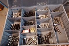 Metal Frame Wood Top Bench with Contents of Fasteners and Tools