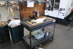 Machines Used | Metal Table with Drawer with Misc Contents