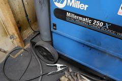 Miller Millermatic 250X MIG Welding Power Source with Torch, Ground Clamp, Regulator Supplies and More