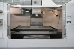 Haas VF-6B/40 CNC Vertical Machining Center with  4th Axis Drive, Probing,  Programmable Coolant Nozzle, Chip Auger, Thru Spindle Coolant