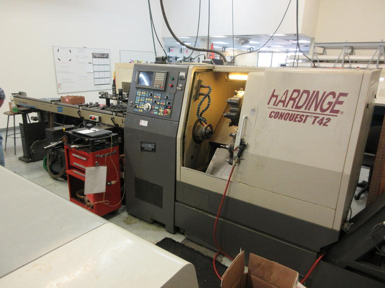 Hardinge Conquest T-42 CNC 3-Axis 2-Turret Turning Center with Har-Matic Bar Feeder Fanuc Series 18-T Control, Chip Conveyor and More