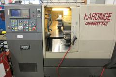 Hardinge Conquest T-42 CNC 3-Axis 2-Turret Turning Center with Har-Matic Bar Feeder Fanuc Series 18-T Control, Chip Conveyor and More