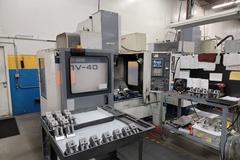 Mori Seiki MV-40 CNC 3-Axis Vertical Machining Center with 20 Station Twin Arm Tool Changer, CT-40 8000 RPM Spindle, Coolant System, Mist Buster