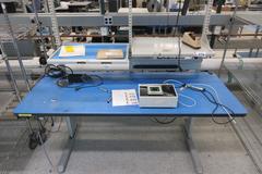 Adjustable Height Work Bench With Upper Shelves and Contents of Universal Device Programmer