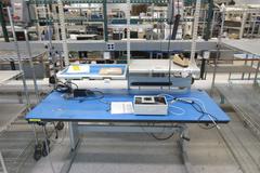 Adjustable Height Work Bench With Upper Shelves and Contents of Universal Device Programmer