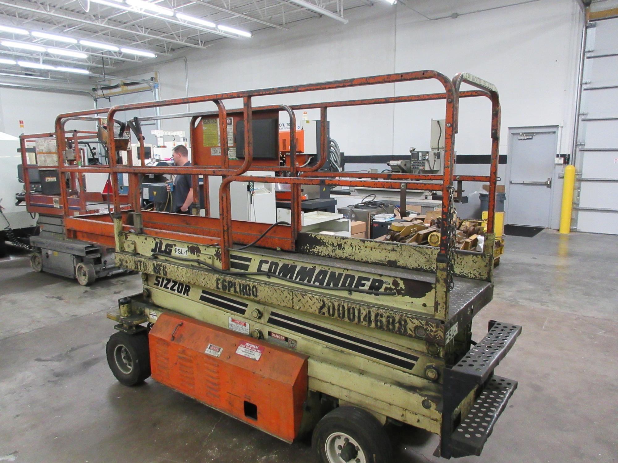 Machines Used | JLG CM-2033 Scissor Lift with 20' Max Platform