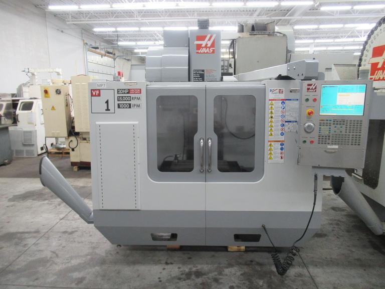 Haas VF-1 CNC Vertical Machining Center with 15,000 RPM CT-40 Spindle, High Speed Machining, Probing, Side-Mount Tool Changer, Macros, and Chip Auger.