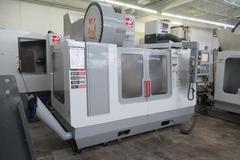 Haas VF-3 CNC Vertical Machining Center with 15,000 RPM CT-40 Spindle, 4th Axis Ready, 40 Station Side Mount Tool Changer,  Probing, Macros, Thru-Spindle Coolant, Mist Collector, and Chip Auger.