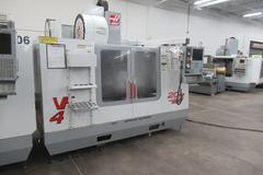 Haas VF-4 CNC Vertical Machining Center, 10K Spindle, 2-Speed Gearbox, 24 Station Twin-Arm ATC, Chip Auger
