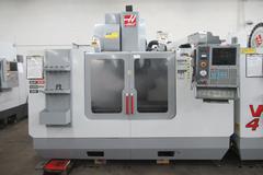 Haas VF-4 CNC Vertical Machining Center with 15,000 RPM Spindle, 24 Station ATC, 4th Axis Drive - (3) 4-Sided Chick Indexers