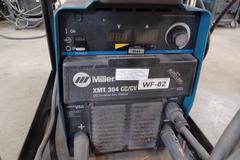 Miller XMT 304 with Wire Feeder, MIG Gun, Ground Clamps, Regulator and Cart