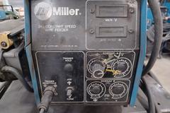 Miller XMT 304 with Wire Feeder, MIG Gun, Ground Clamps, Regulator and Cart