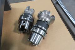 HSK63 Face Mill Holders and Face Mills (4) 2" Face Mills, (2) 2-1/2" Face Mills, with Tool Rack and Assorted Carbide Inserts