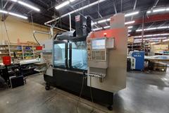 2022 Haas VF-5 CNC Vertical Machining Center with 30,000 RPM Spindle, Side Mount Tool Changer, Programmable Coolant Nozzle, High Speed Machining and More