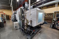 2022 Haas VF-5 CNC Vertical Machining Center with 30,000 RPM Spindle, Side Mount Tool Changer, Programmable Coolant Nozzle, High Speed Machining and More