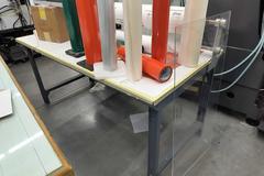 Machines Used | Metal Bench with Contents of Roll Dispensers and Material