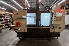2022 Haas VF-5 CNC Vertical Machining Center with 30,000 RPM Spindle, Side Mount Tool Changer, Programmable Coolant Nozzle, High Speed Machining and More
