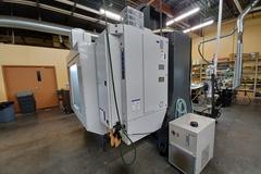 2022 Haas VF-5 CNC Vertical Machining Center with 30,000 RPM Spindle, Side Mount Tool Changer, Programmable Coolant Nozzle, High Speed Machining and More