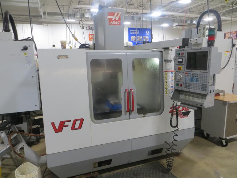 Haas VF-0 CNC Vertical Machining Center, Haas 32-Bit CNC Control, 4th Axis Drive, 20-Station Tool Changer, Programmable Coolant, Remote Jog Handle, Chip Auger 