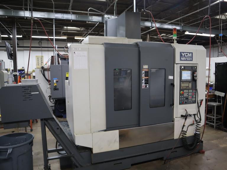 YCM Model NSV102A CNC Vertical Machining Center, 12K Spindle, 30 Station Side Mount ATC, Chip Conveyor