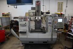 Haas VF-2SS CNC Vertical Machining Center, 12K Spindle, 4th Axis Brushless Drive with SHRT-160H Rotary Table, 24 Station SMTC, Probing, Chip Auger 