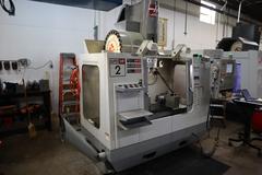 Haas VF-2SS CNC Vertical Machining Center, 12K Spindle, 4th Axis Brushless Drive with SHRT-160H Rotary Table, 24 Station SMTC, Probing, Chip Auger 