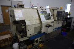 Okuma LB15 II CNC Lathe Turning Center, OSP700L CNC, 12 Station Turret, Tailstock, 8" Chuck, Chip Conveyor