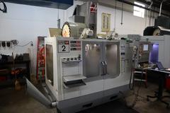 Haas VF-2SS CNC Vertical Machining Center, 12K Spindle, 4th Axis Brushless Drive with SHRT-160H Rotary Table, 24 Station SMTC, Probing, Chip Auger 
