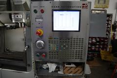 Haas VF-2SS CNC Vertical Machining Center, 12K Spindle, 4th Axis Brushless Drive with SHRT-160H Rotary Table, 24 Station SMTC, Probing, Chip Auger 