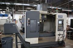 YCM Model NSV102A CNC Vertical Machining Center, 12K Spindle, 30 Station Side Mount ATC, Chip Conveyor