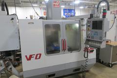 Haas VF-0 CNC Vertical Machining Center, Haas 32-Bit CNC Control, 4th Axis Drive, 20-Station Tool Changer, Programmable Coolant, Remote Jog Handle, Chip Auger 